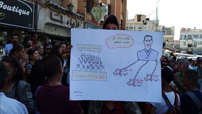 بالفن والرسم  .. المتظاهرون في السويداء يطالبون برحيل بشار ألأسد