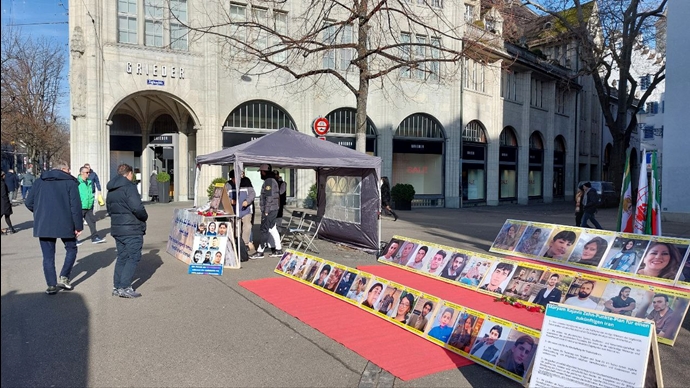 زيورخ سويسرا – طاولة كتاب ومعرض لصور الشهداء احتجاجا على عمليات الإعدام في إيران