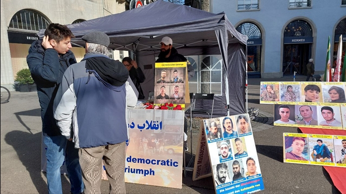 زيورخ سويسرا – طاولة كتاب ومعرض لصور الشهداء احتجاجا على عمليات الإعدام في إيران