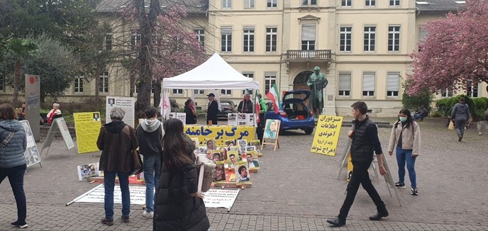 تقرير مصور – هایدلبرغ – طاولة كتب ومعرض لصور شهداء الانتفاضة الإيرانية