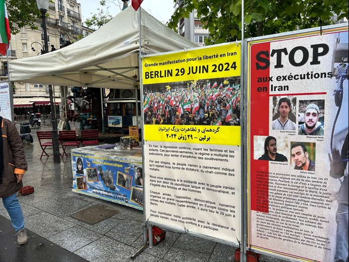 تقرير مصور - باريس - طاولة كتب ومعرض لصور شهداء الانتفاضة الإيرانية