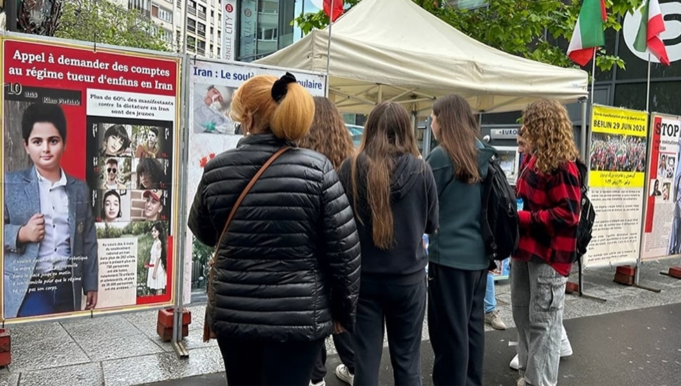 تقرير مصور - باريس - طاولة كتب ومعرض لصور شهداء الانتفاضة الإيرانية