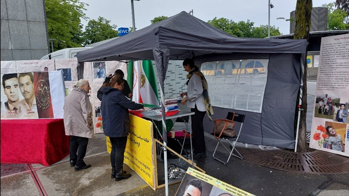 لوتزيرن سويسرا – طاولة كتب ومعرض لصور الشهداء تضامنا مع الانتفاضة الوطنية في إيران