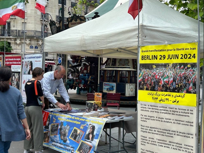 باريس وستوكهولم - طاولة كتاب ومعرض لصور شهداء الانتفاضة الإيرانية