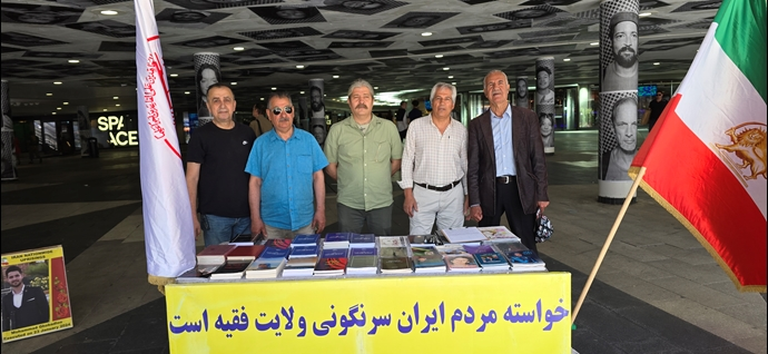 باريس وستوكهولم - طاولة كتاب ومعرض لصور شهداء الانتفاضة الإيرانية