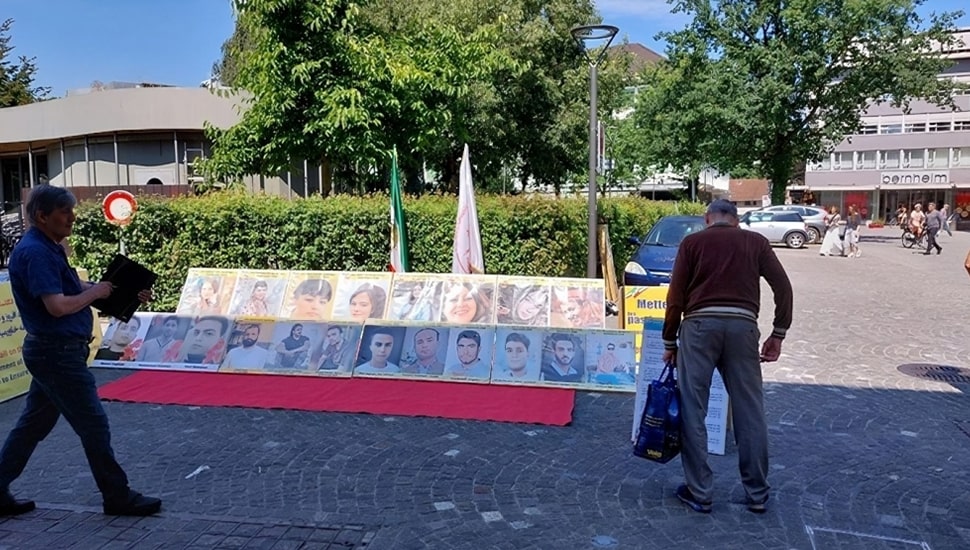 تقرير مصور - أراو سويسرا - طاولة كتب ومعرض لصور شهداء الانتفاضة الإيرانية