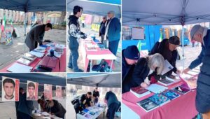 مانشستر، إنجلترا - طاولة كتاب ومعرض لصور شهداء الانتفاضة الإيرانية  